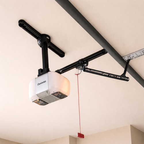 Technician installing a silent automatic garage door motor and smart opener in a Darwin home.